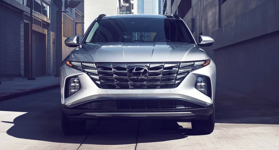 A gray 2023 Hyundai Tucson small SUV is parked.