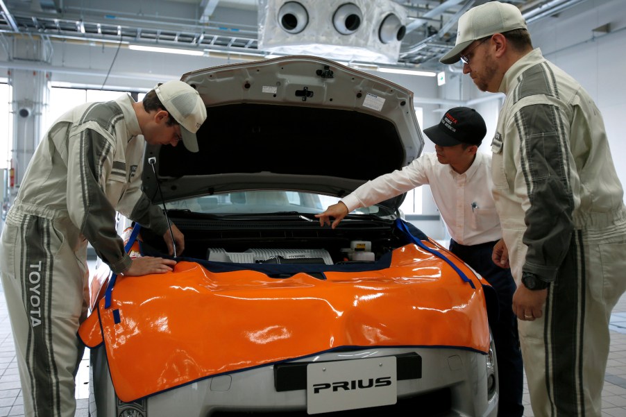 Toyota dealership technicians in training learn how to replace a Prius hybrid high-voltage battery.