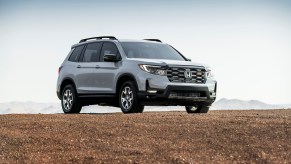 A 2022 Honda Passport TrailSport SUV parked on dirt