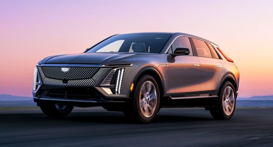 A gray 2023 Cadillac LYRIQ luxury electric SUV is driving.