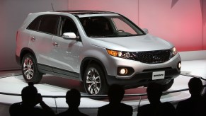 A silver 2009 Kia Sorento on display ate an auto show.