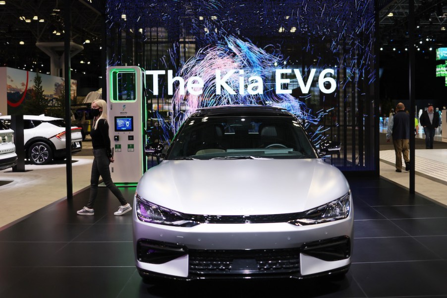 A silver Kia EV6 parked indoors.