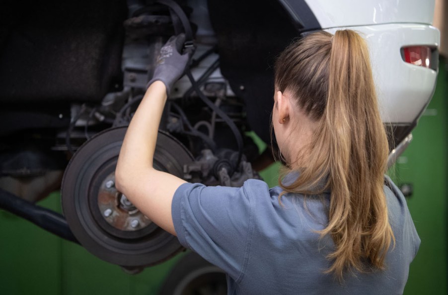 A mechanic potentially working on the car with the cheapest 10-year maintenance.