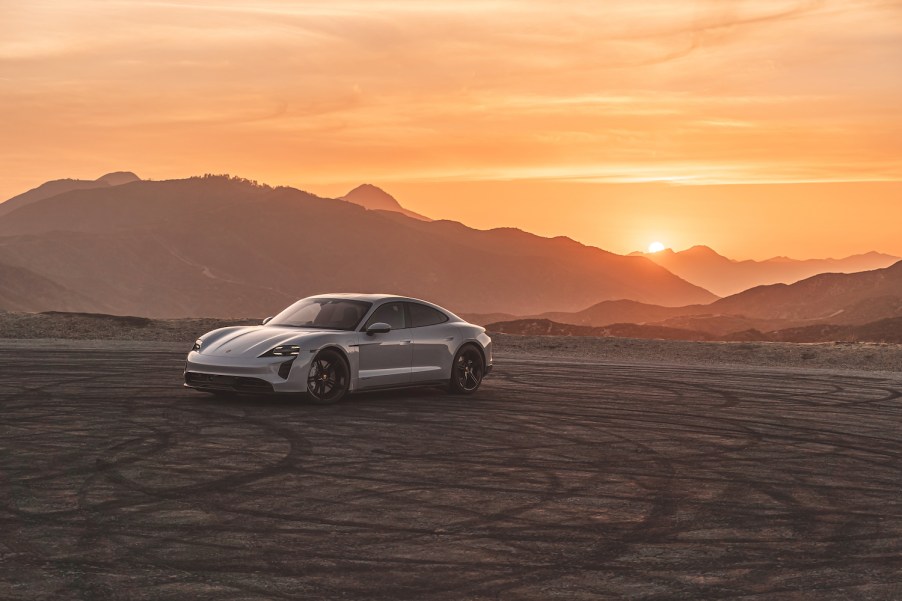 A Porsche Taycan luxury car parked at dusk