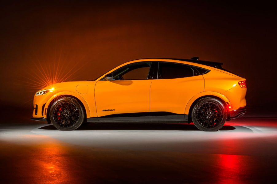 A yellow-gold 2023 Ford Mustang Mach-E GT Performance Edition compact electric SUV with the Nite Pony Package