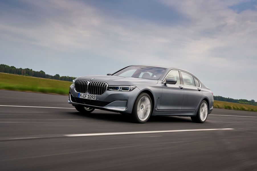 A silver-gray 2020 BMW 7 Series full-size luxury sedan model driving down a highway