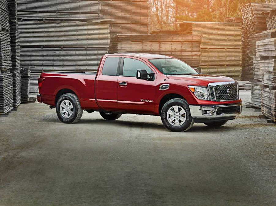 A red nissan titan sits in a warehouse