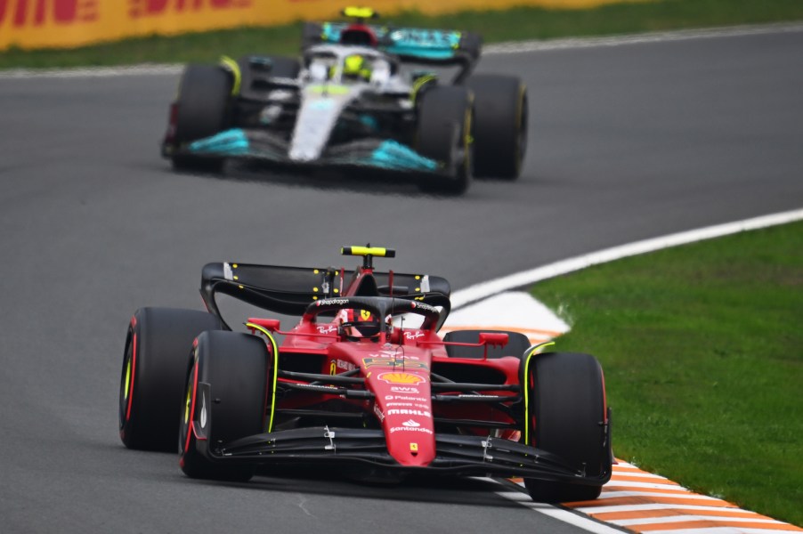 A mercedes and ferrari race car competing during a Formula 1 race, may soon be joined by a Ford.