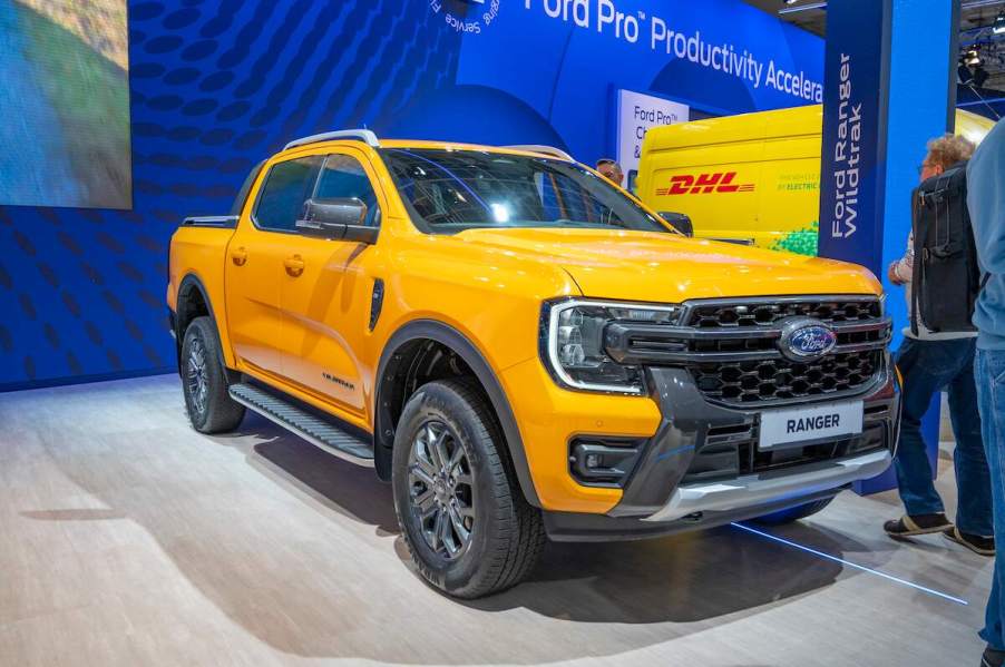 A yellow Ford Ranger parked indoors.