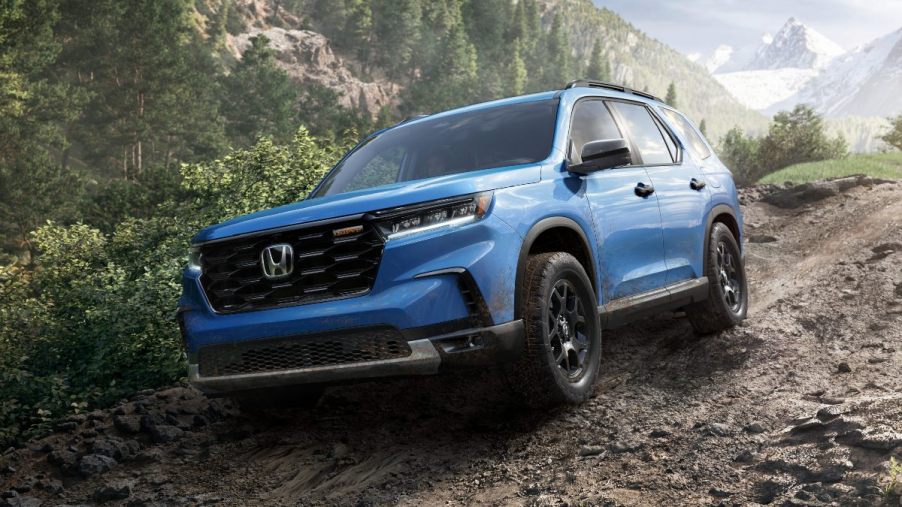 Front angle view of blue 2023 Honda Pilot midsize SUV