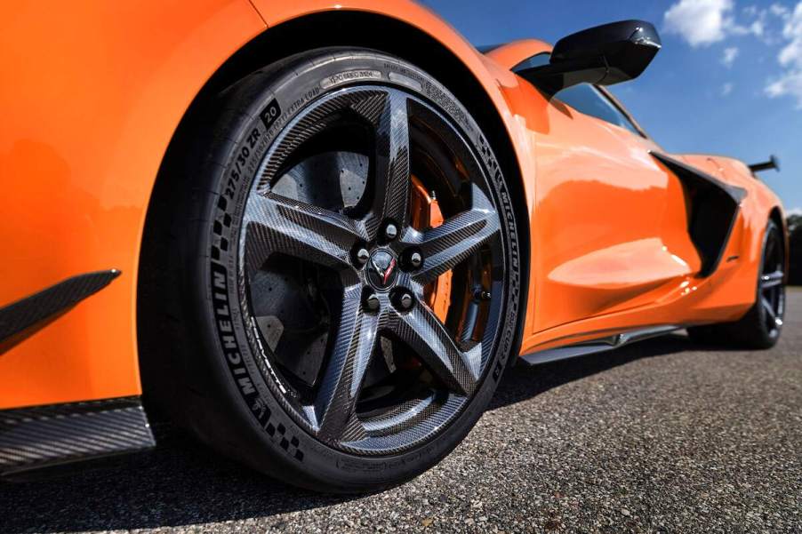 An orange 2023 Chevrolet Corvette Z06 on a blacktop surface.