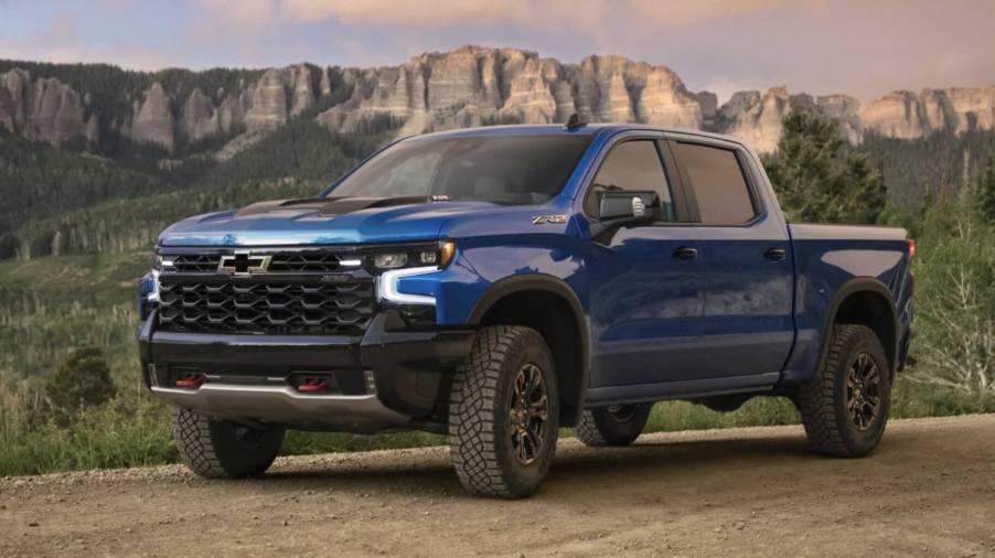 The 2023 Chevy Silverado off-roading in a field .