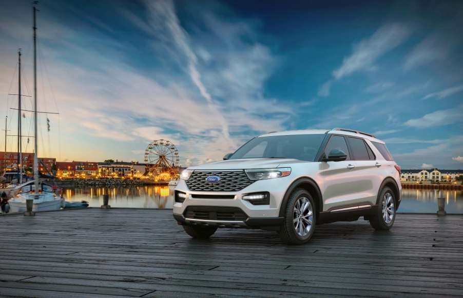 2023 Ford Explorer in white parked in front of water