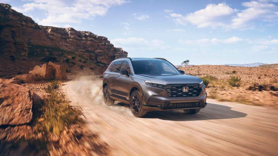 A 2023 Honda CR-V driving down a desert road.