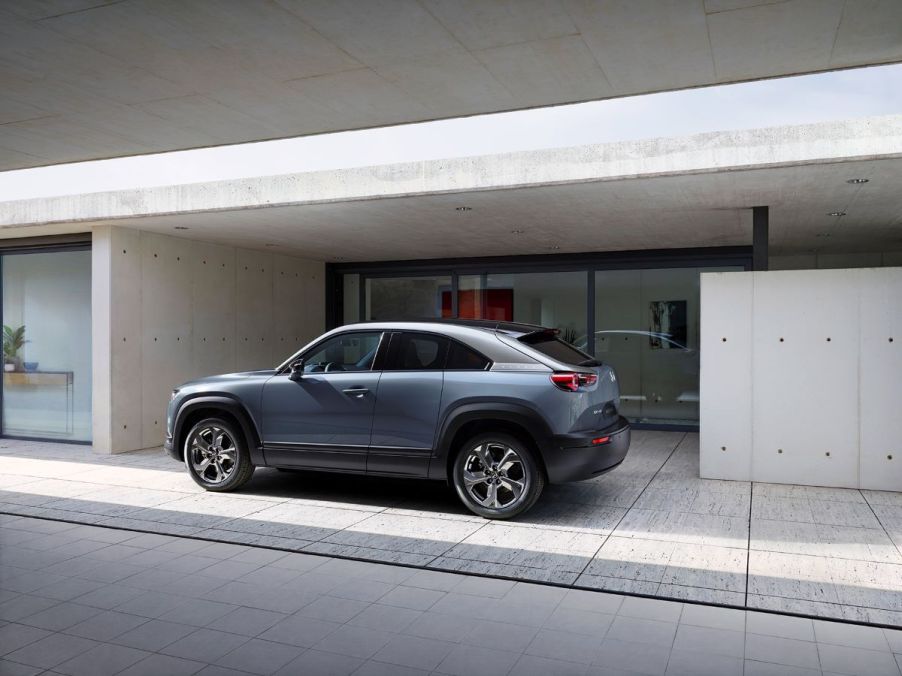 A blue-gray 2023 Mazda MX-30 all-electric (EV) subcompact crossover SUV model