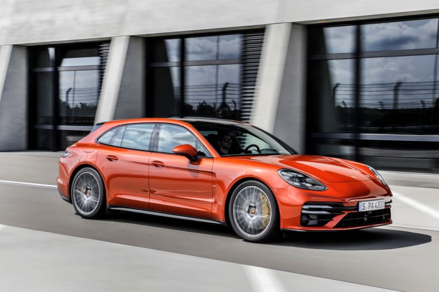 An orange Porsche Panamera Turbo S from the best luxury car brand of 2023