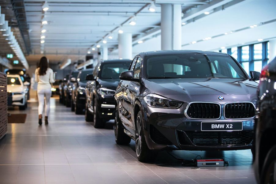 A customer walks through a BMW dealership.