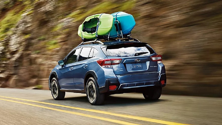 Rear angle view of blue 2023 Subaru Crosstrek crossover SUV, highlighting most common problems and if it’s reliable