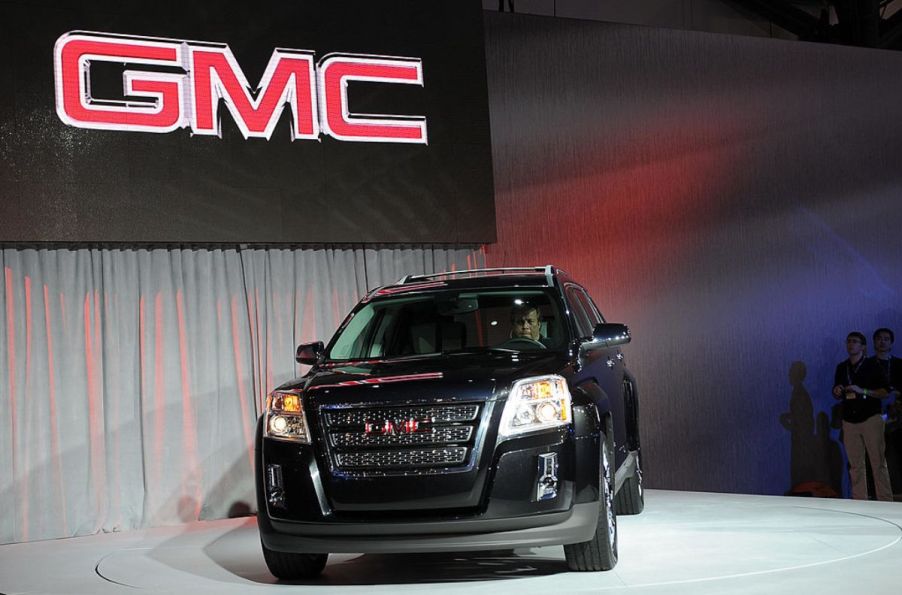 A black GMC Terrain on display at an auto show