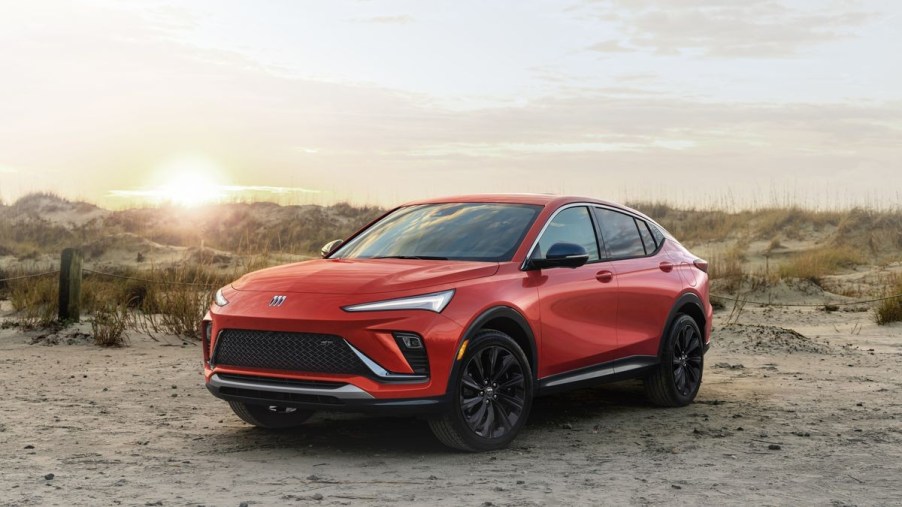 Red 2024 Buick Envista with a sunset background - This Buick SUV is the final gas-powered model from the brand