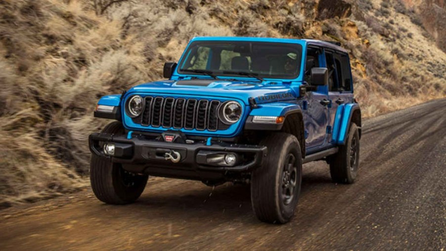 2024 Jeep Wrangler Rubicon Riding Down a Dirt Trail