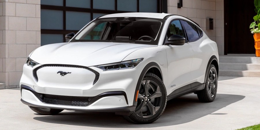 A white 2023 Ford Mustang Mach-E small electric SUV is parked.