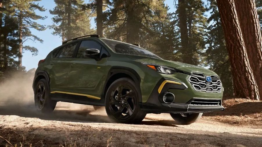 Front angle view of green 2024 Subaru Crosstrek Wilderness crossover SUV