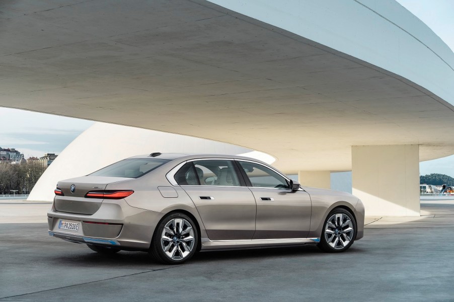 A gold BMW i7 parked