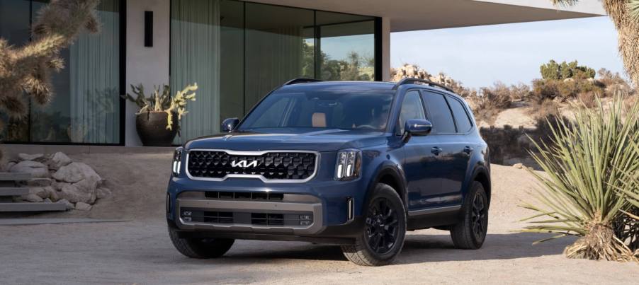 The 2023 Kia Telluride parked in front of a home