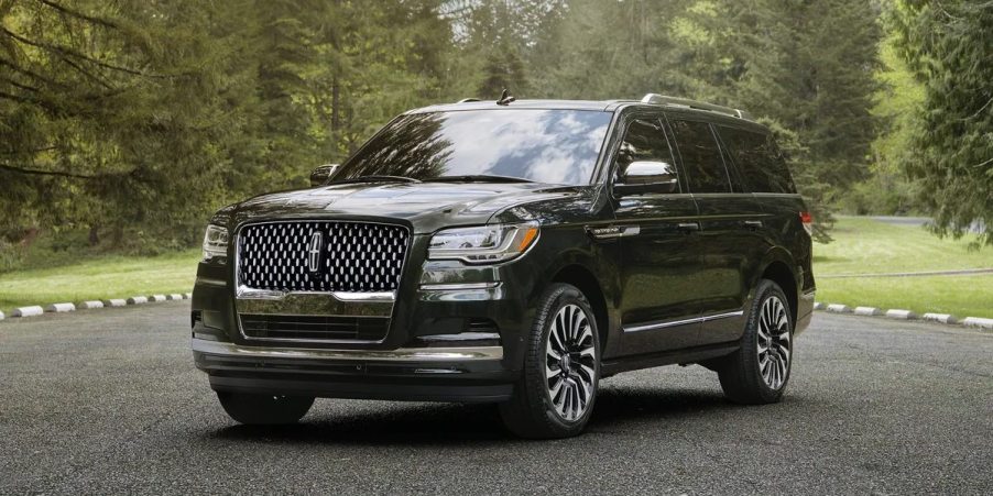 A black 2023 Lincoln Navigator full-size SUV is parked.