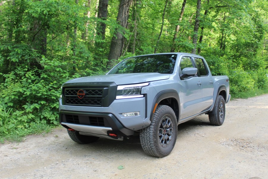 The 2023 Nissan Frontier Pro-4X off-roading on a dirt trail