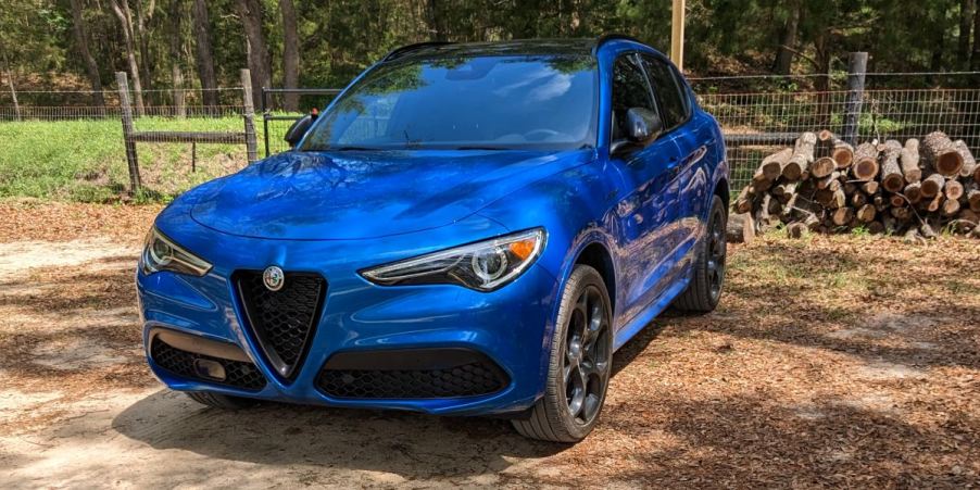 A blue 2023 Alfa Romeo Stelvio small luxury SUV is parked.