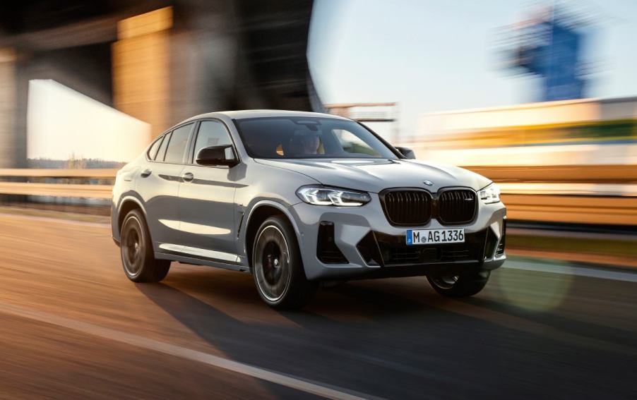 A BMW X4 driving on a highway.