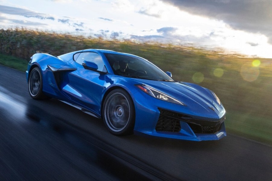 A blue C8 2023 Chevrolet Corvette Z06 cruises a country road.