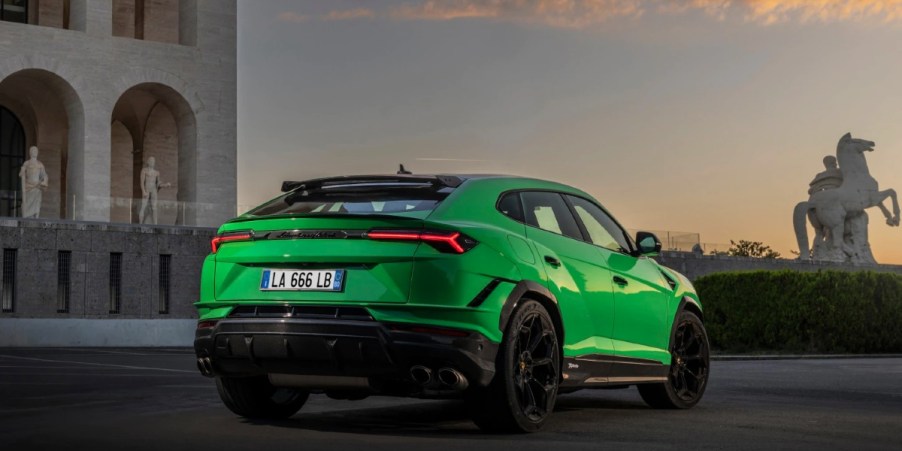 The back of a green 2023 Lamborghini Urus.