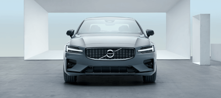 A front-facing 2023 Volvo S60 compact executive car/luxury sedan model with a background of white frames