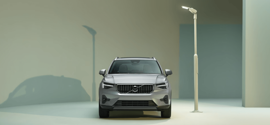 A promotional shot of a 2023 Volvo XC40 subcompact luxury SUV model illuminated by a white streetlight