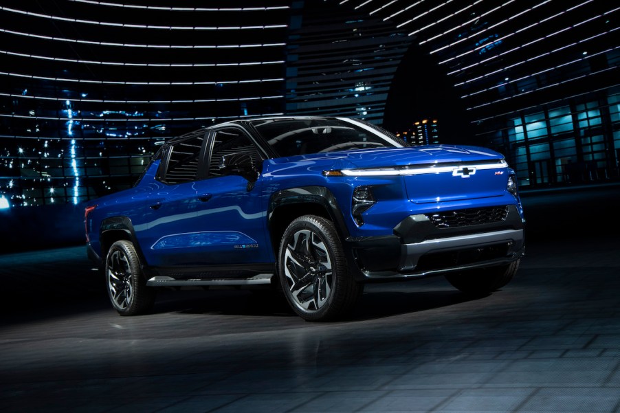 A blue 2024 Chevy Silverado EV on display