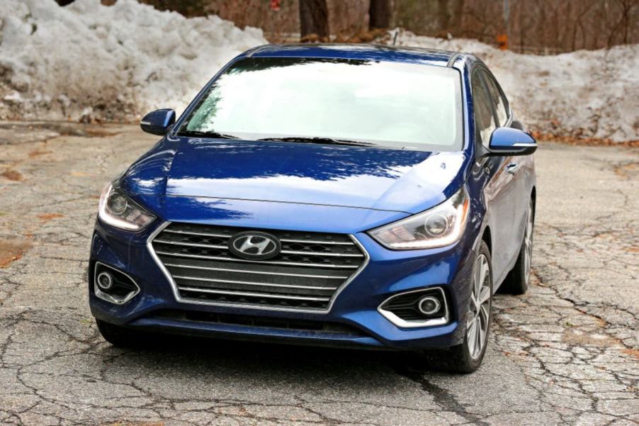 A blue Hyundai Accent on display.