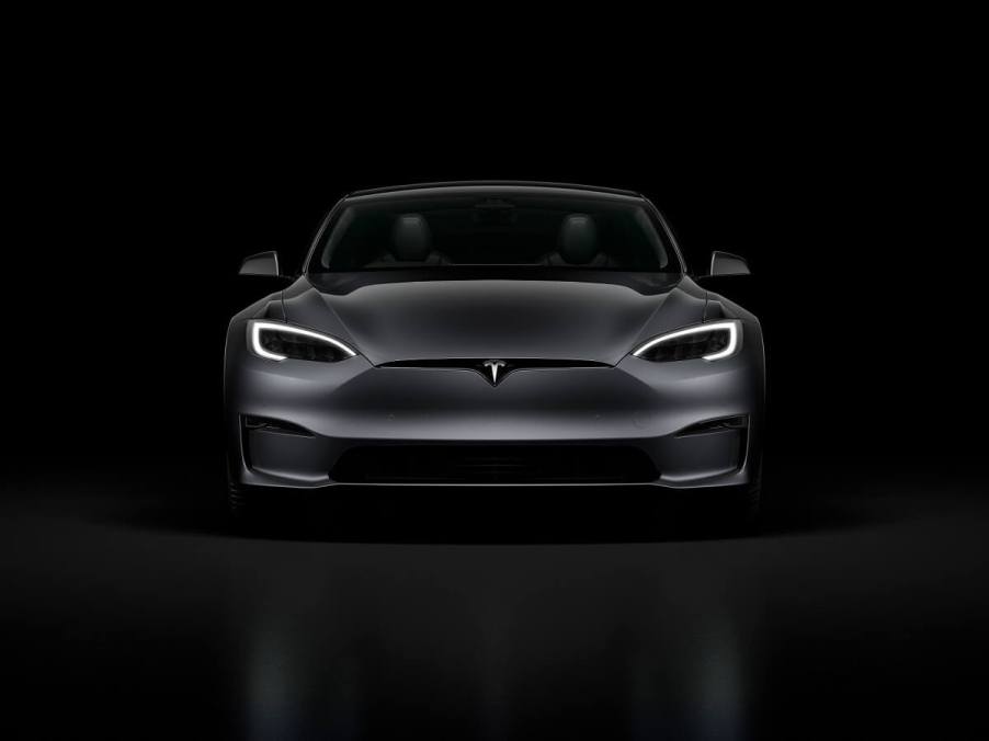 A Tesla Model S flashes its running lights.