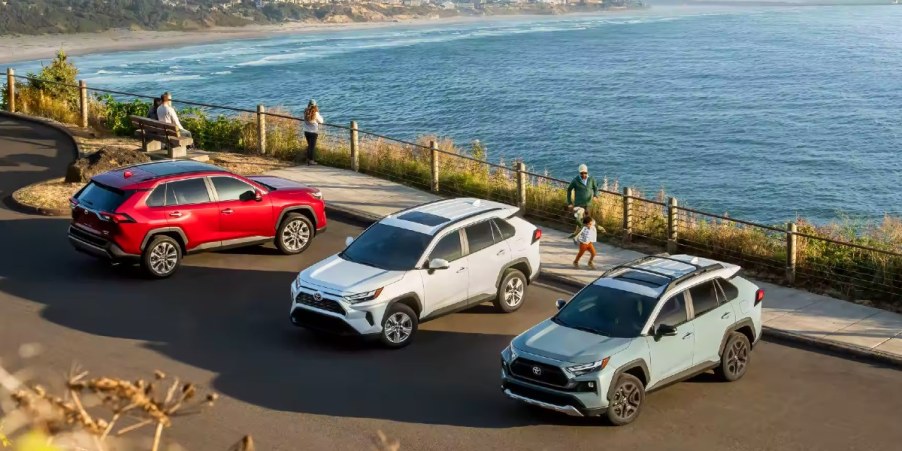 Three Toyota small SUVs are parked.