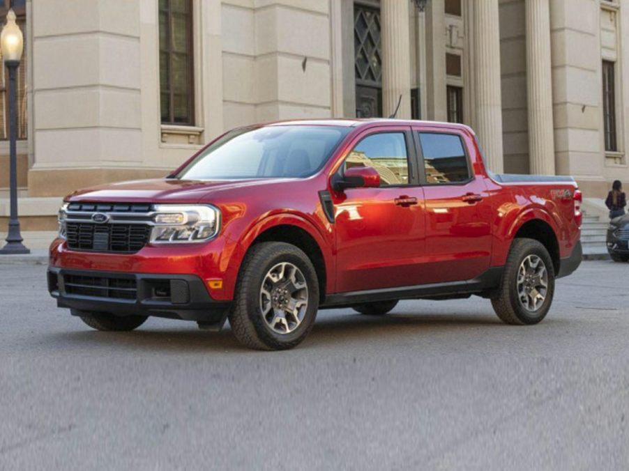 A red 2023 Ford Maverick parked in the city