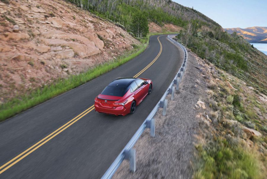 A far driving view of the 2024 Toyota Camry Hybrid