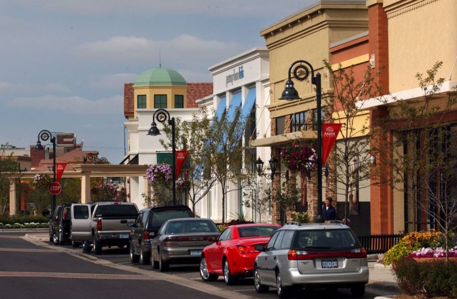 Cars parallel parked on a main street down town