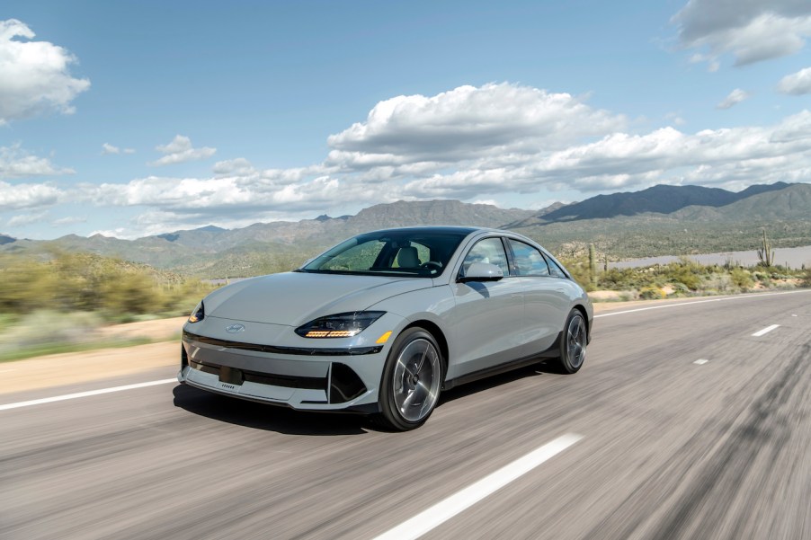 The 2023 Hyundai Ioniq 6 in gray speeding down a desert road. The Hyundai Ioniq 6 sales are slowly starting to pick up