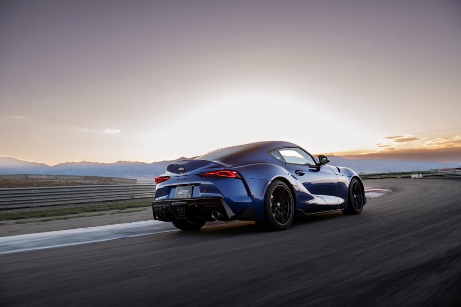 A Mk5 Supra, a 2023 or 2024 Toyota GR Supra model, drives on a track.