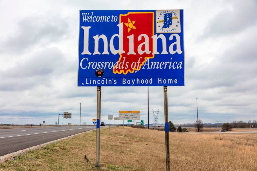 A welcome to Indian sign on interstate highway I-70, a major semi-truck thoroughfare.