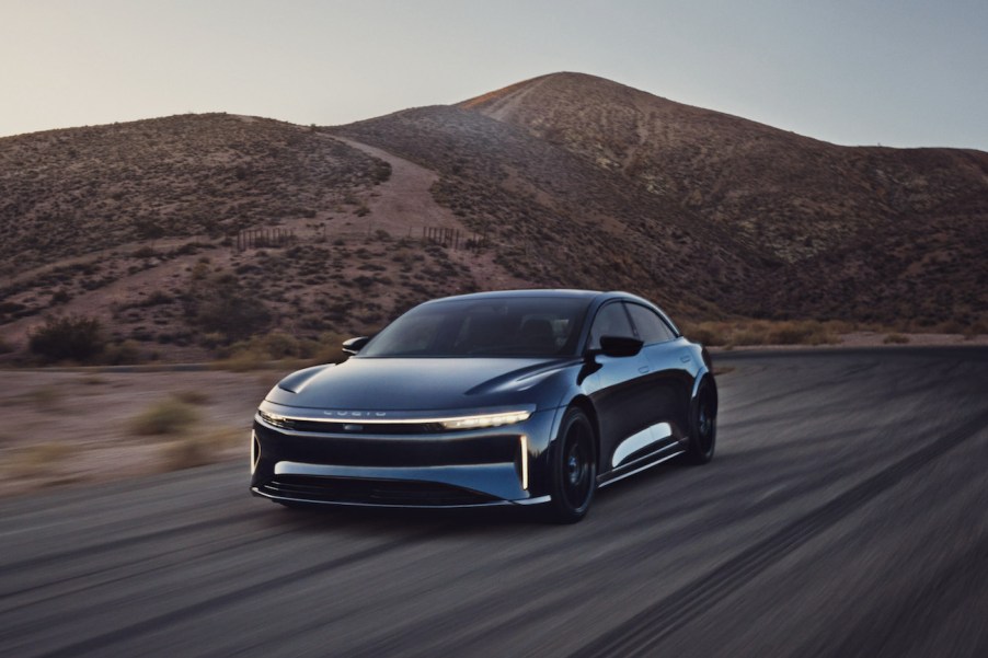 A dark blue Lucid Air Sapphire on a desert road. The Lucid Air Sapphire's price isn't for the faint-hearted.