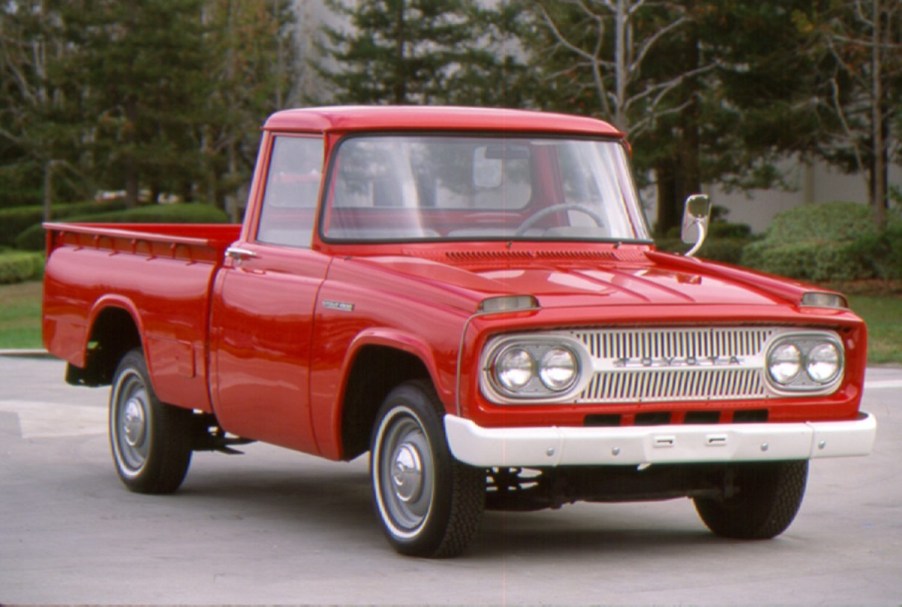 A 1965 Toyota Stout model driving down the road