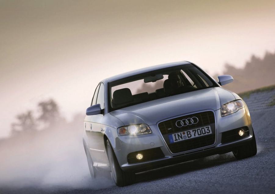 A silver 2005 Audi S4 drifting